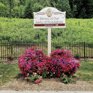 enterance-sign-flowers-shrine-our-lady-guadalupe-church-la-crosse-wisconsin-gallery Entrance sign to Our Lady of Guadalupe Shrine in La Crosse, Wisconsin.