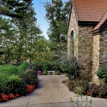 outside-votive-candle-chapel-shrine-our-lady-guadalupe-church-la-crosse-wisconsin-gallery Walkway path leading to the votive candle chapel at Our Lady of Guadalupe Shrine in La Crosse, Wisconsin.