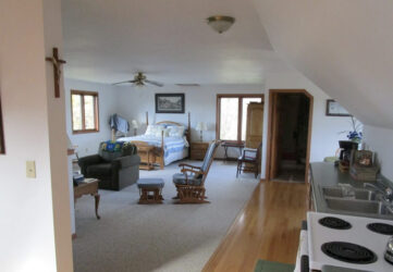 saint-josephs-farm-holy-angels-guest-house-westby-wisconsin-interior-2-gallery Bedroom and living room area at St. Joseph's Farm, Holy Angels Guest House in Westby, Wisconsin.