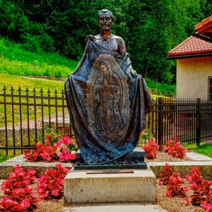 saint-juan-diego-statue-shrine-our-lady-guadalupe-la-crosse-wisconsin Statue of Lady Guadalupe appearing on the cloak of Juan Diego at Our Lady of Guadalupe Shrine in La Crosse, Wisconsin.