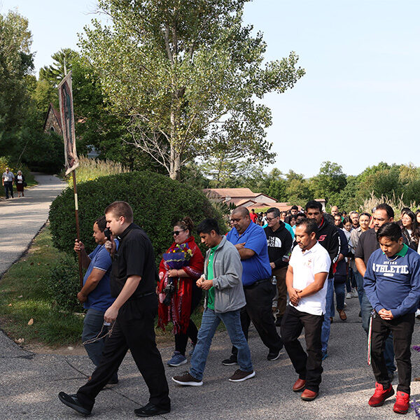 On Hispanic Day of Pilgrimage, a group of Hispanics are participating in an uphill procession with Our Lady of Guadalupe in La Crosse, Wisconsin. On Hispanic Day of Pilgrimage, a group of Hispanics are participating in an uphill procession with Our Lady of Guadalupe in La Crosse, Wisconsin.