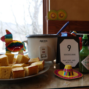 Guadalupe Shrine Chili Cookoff contestant Green Verde Chili with Cornbread and colorful festive decorations! Guadalupe Shrine Chili Cookoff contestant Green Verde Chili with Cornbread and colorful festive decorations includes hat and pinata