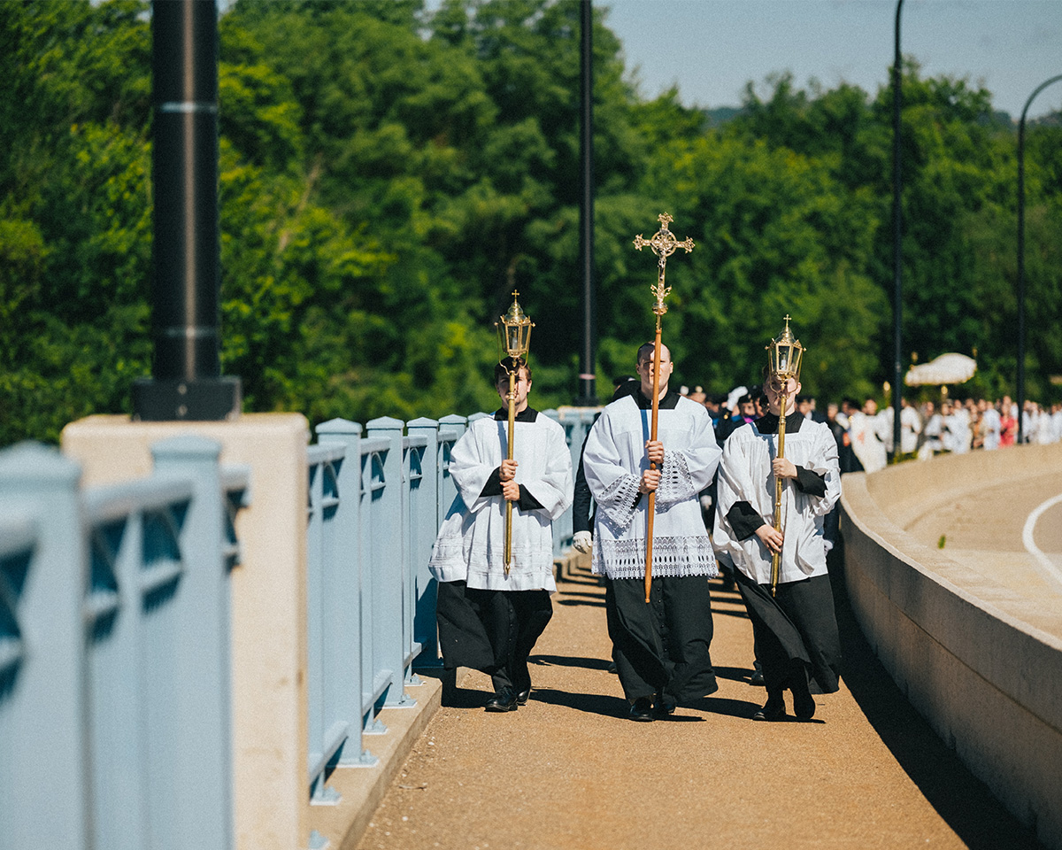 Eucharistic Procession led by Altar Servers on the sidewalk National Eucharistic Procession Image of Eucharistic Procession In La Crosse, Wisconsin