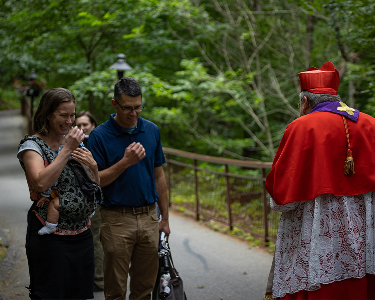 Cardinal Burke Bless a couple with a child on pilgrimage Cardinal Burke Bless a couple with a child on pilgrimage