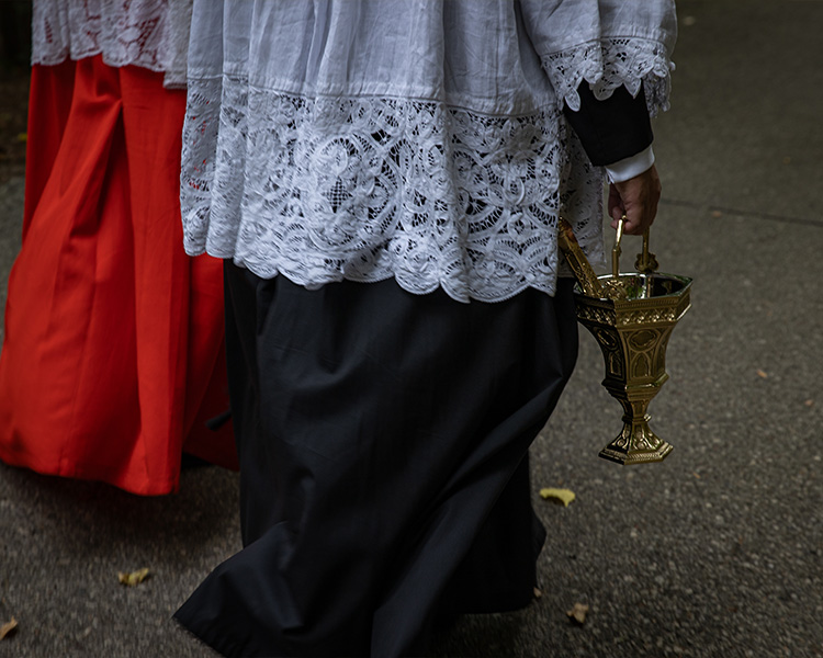 Cardinal Burke walking with aspergillum and aspersorium Cardinal Burke walking with aspergillum and aspersorium
