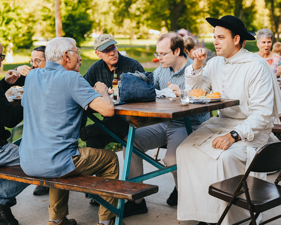 Catholic Church Picnic with Shrine Staff eating at park picnic tables Catholic Church Picnic with Shrine Staff eating at park picnic tables