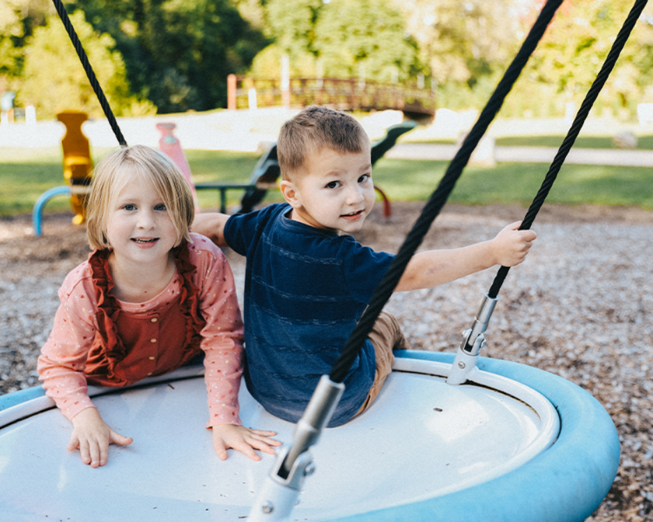 children on swing picnic at the park children on swing picnic at the park