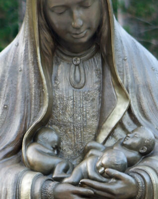 Mary Statue holding God's children in her arms memorial to the Unborn Mary Statue holding God's children in her arms memorial to the Unborn